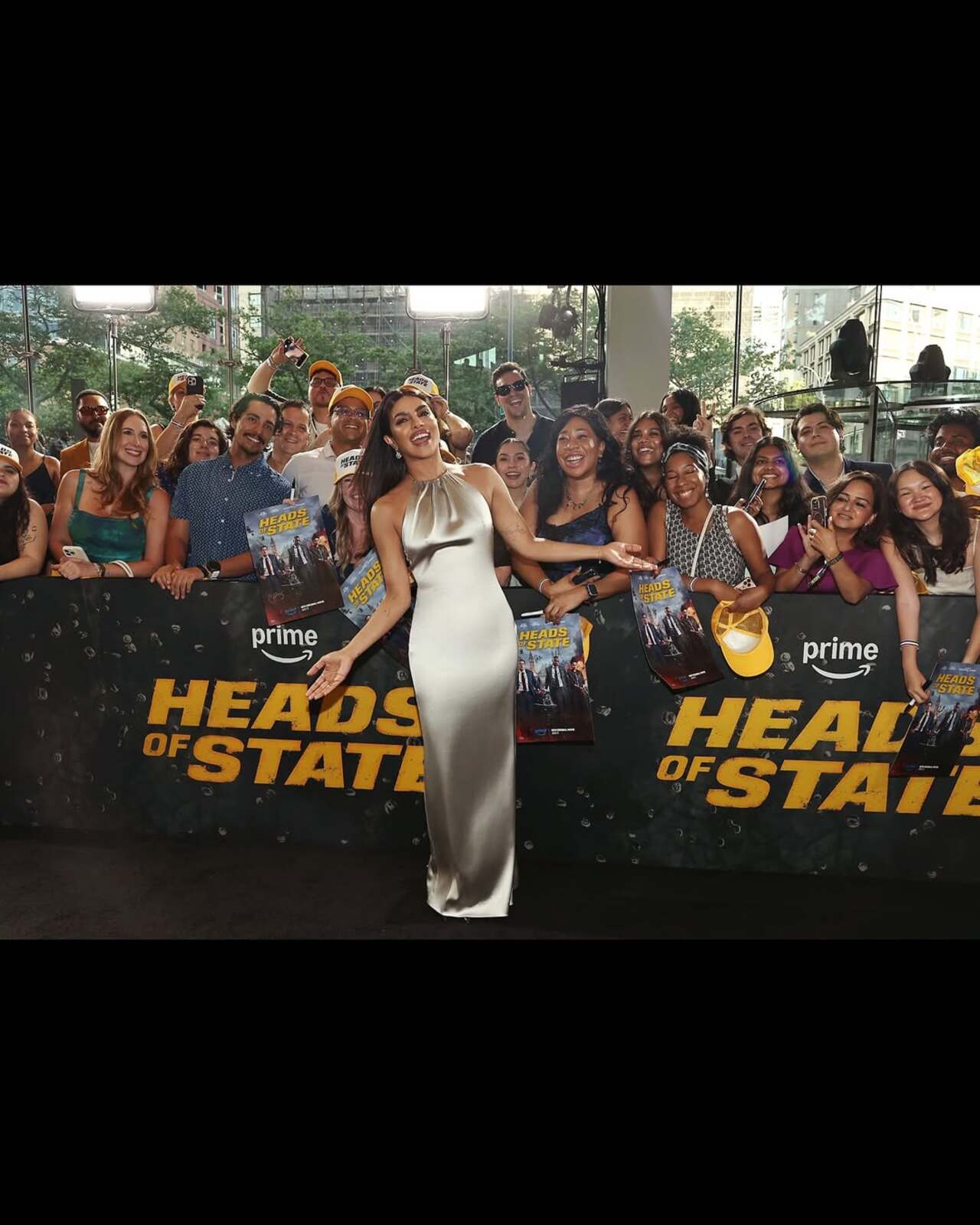 Making the crowd swoon, Priyanka lights up the premiere in a statuesque ivory satin gown that drapes beautifully over her frame. The halter neckline adds a touch of old-Hollywood sophistication, while her sleek hair and glowing skin keep the look contemporary and fresh